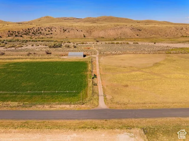 Aerial view of sparsely populated area featuring a mountainous background