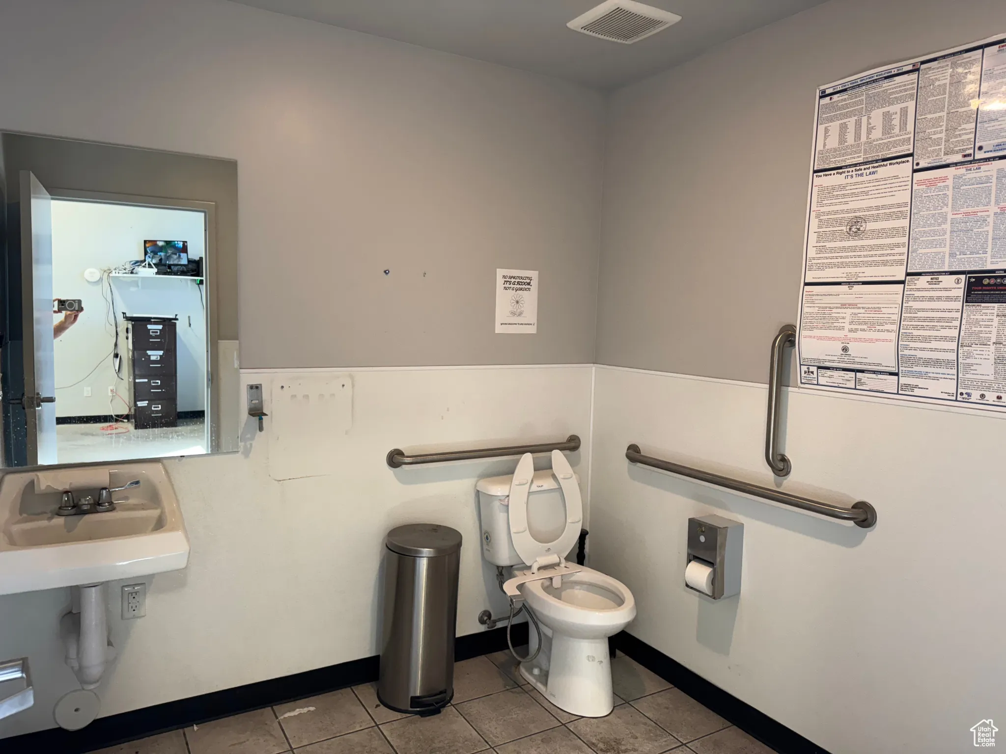 Bathroom featuring toilet and light tile patterned floors