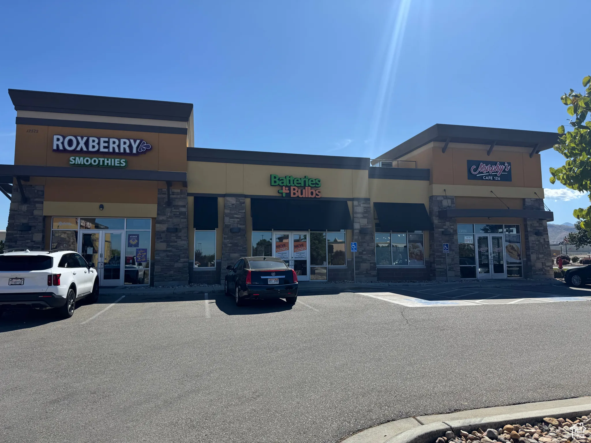 View of commercial location featuring uncovered parking