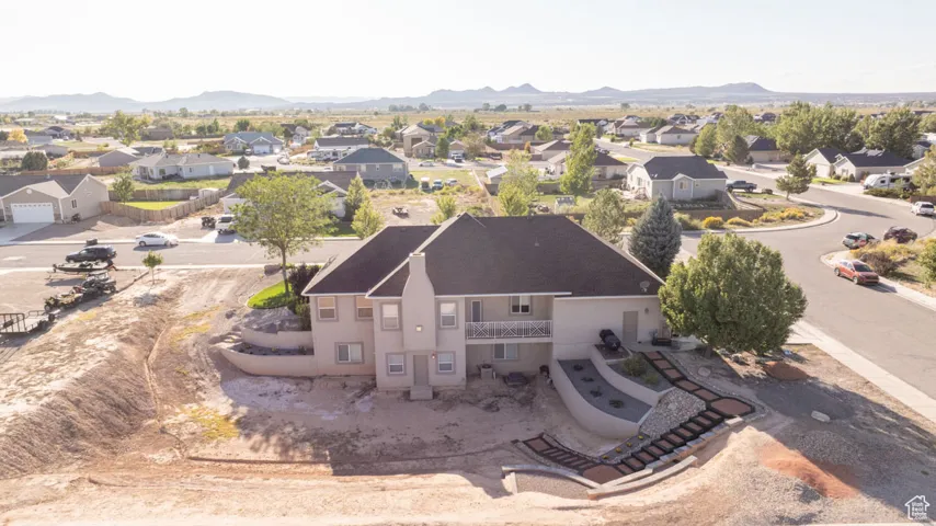 Aerial view of residential area featuring mountains