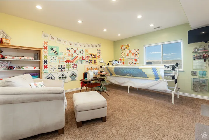 Carpeted bedroom featuring recessed lighting
