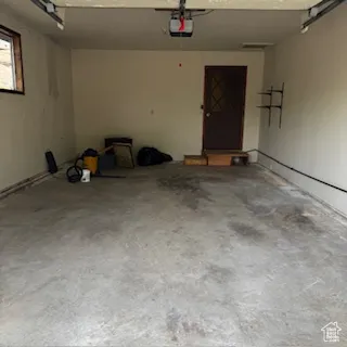 Garage featuring a garage door opener