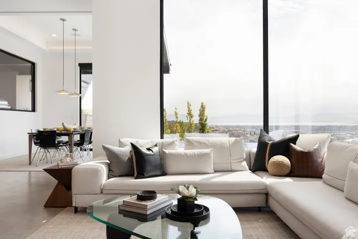 Living room featuring finished concrete floors
