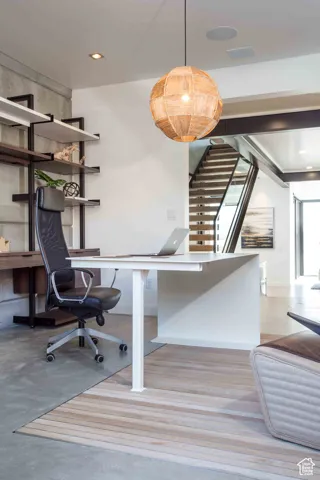 Office area with recessed lighting and light wood-style floors