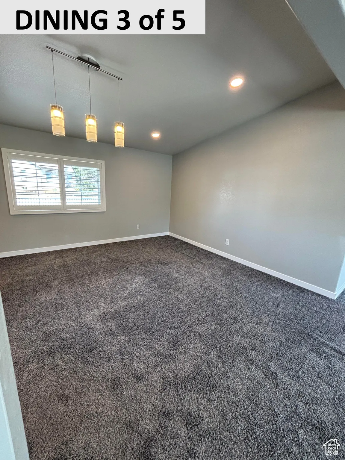 Dining with dark carpet, recessed & track lighting