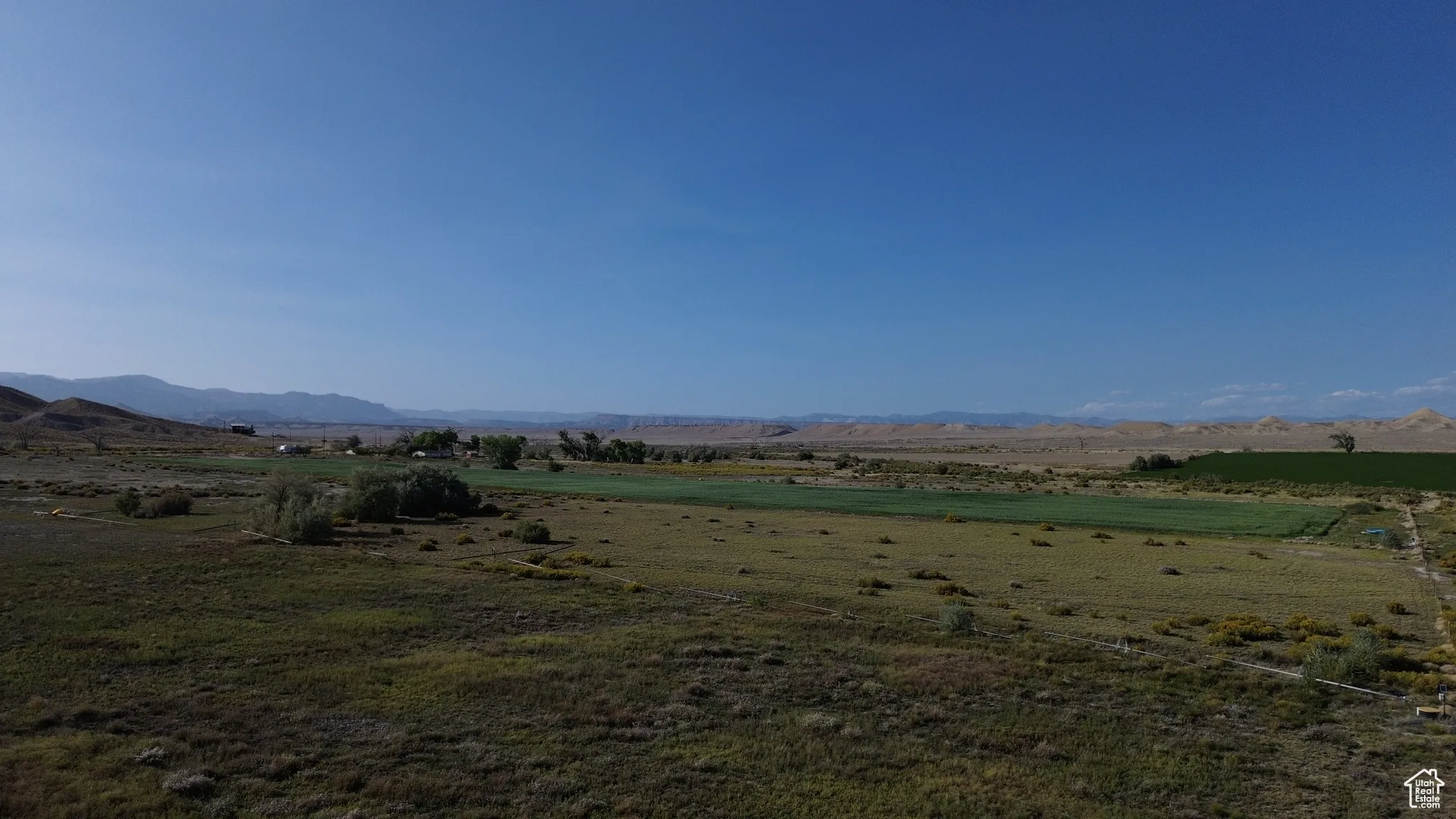 View of mountain backdrop featuring rural landscape