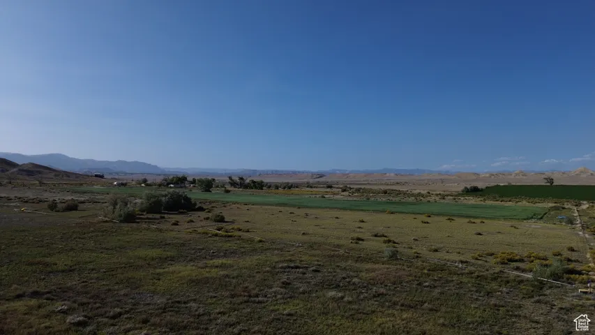 View of mountain backdrop featuring rural landscape