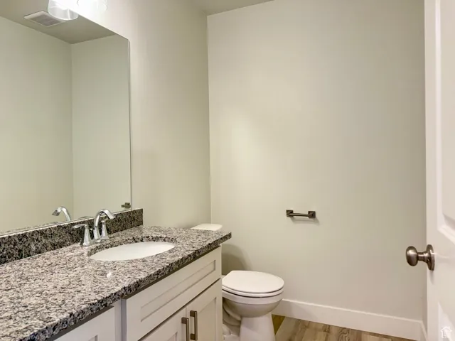 Bathroom featuring vanity and light wood-style flooring