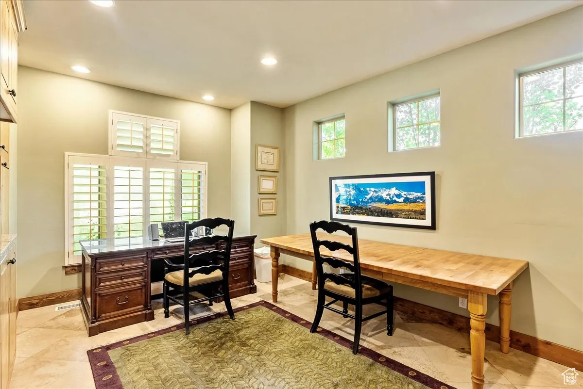 Office space with recessed lighting, light tile patterned floors, and inlaid floor details