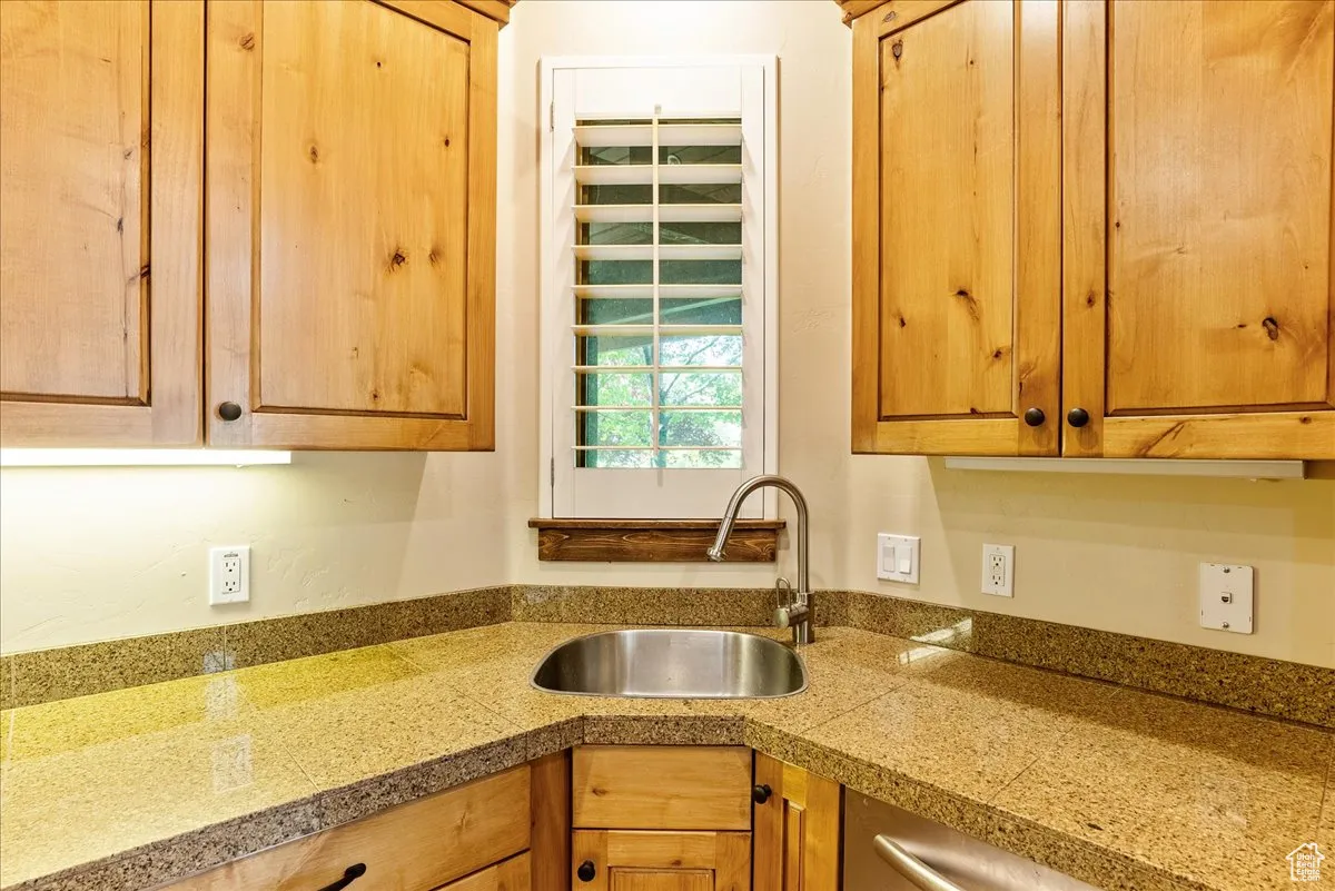 Kitchen featuring tile countertops