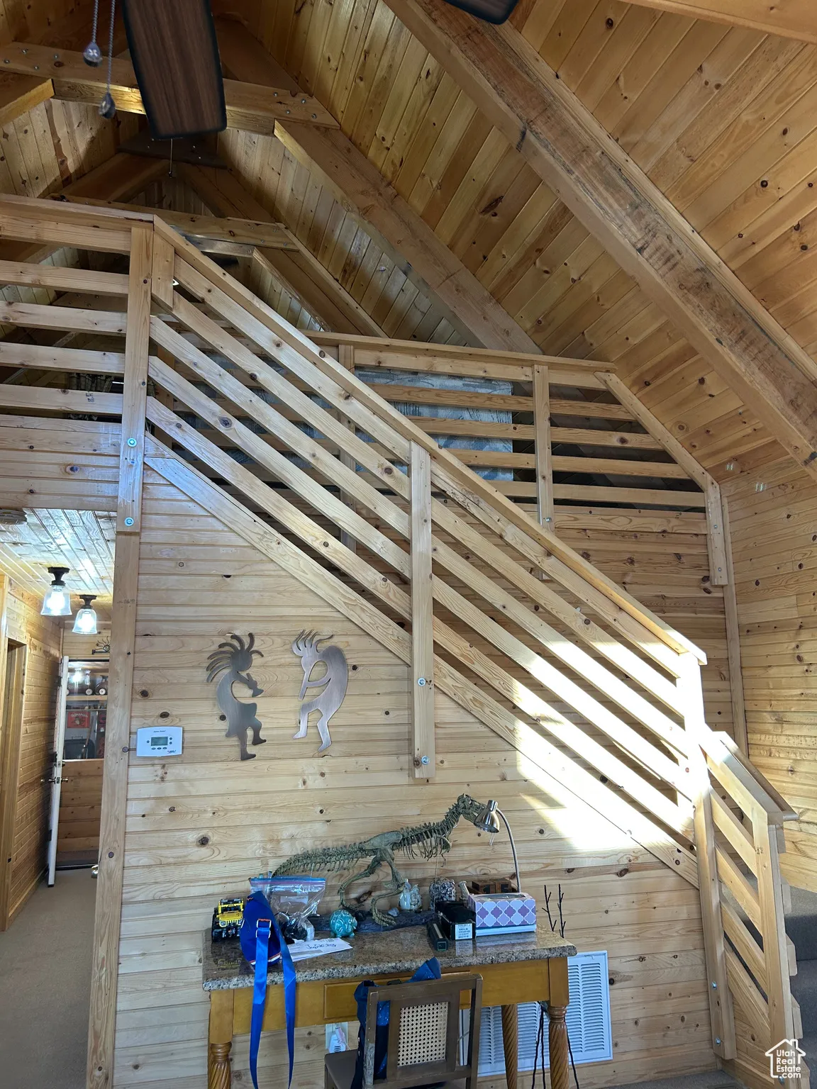Stairs with wood ceiling and wooden walls