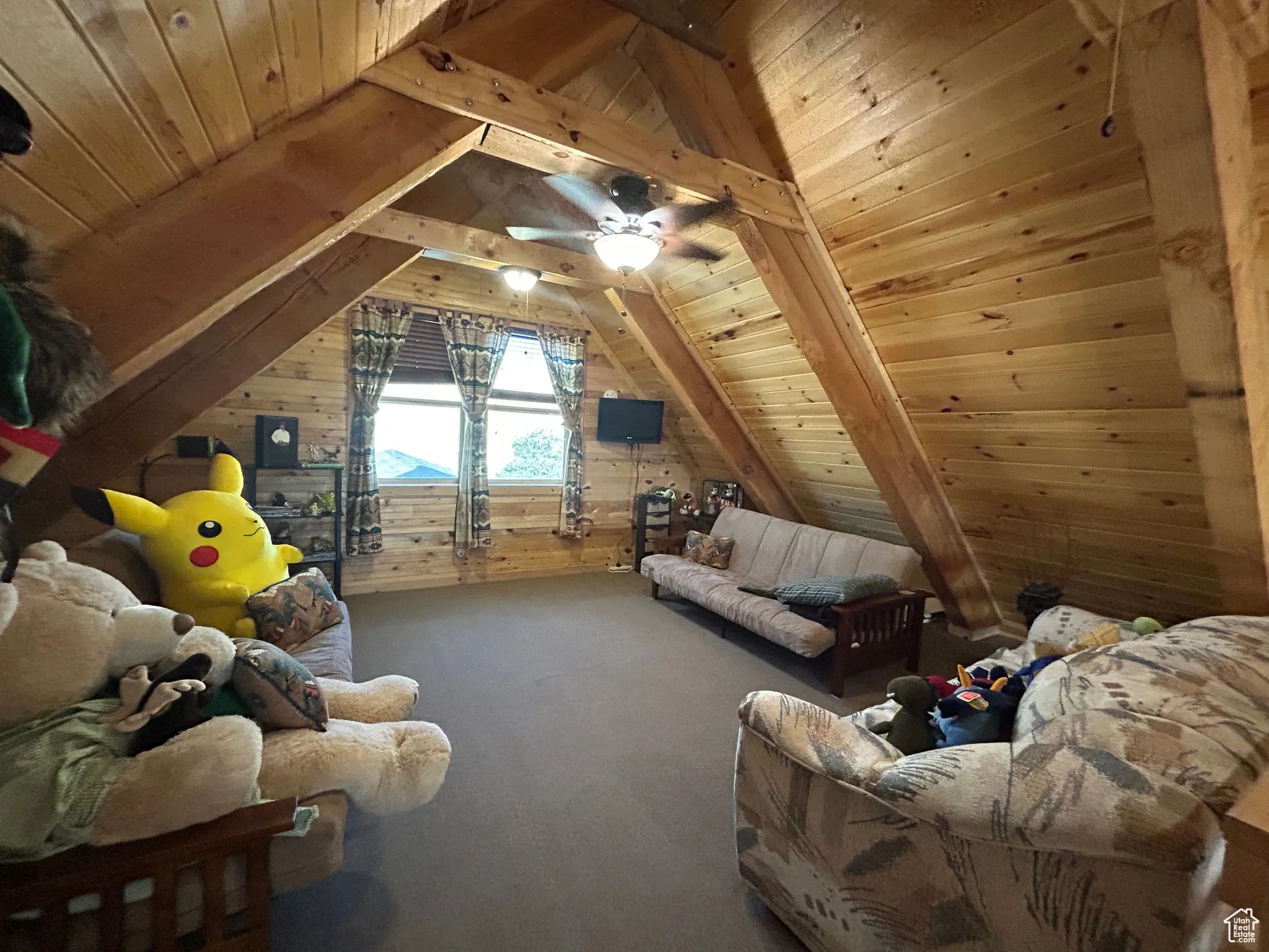 Additional living space featuring wood ceiling, wooden walls, and carpet flooring