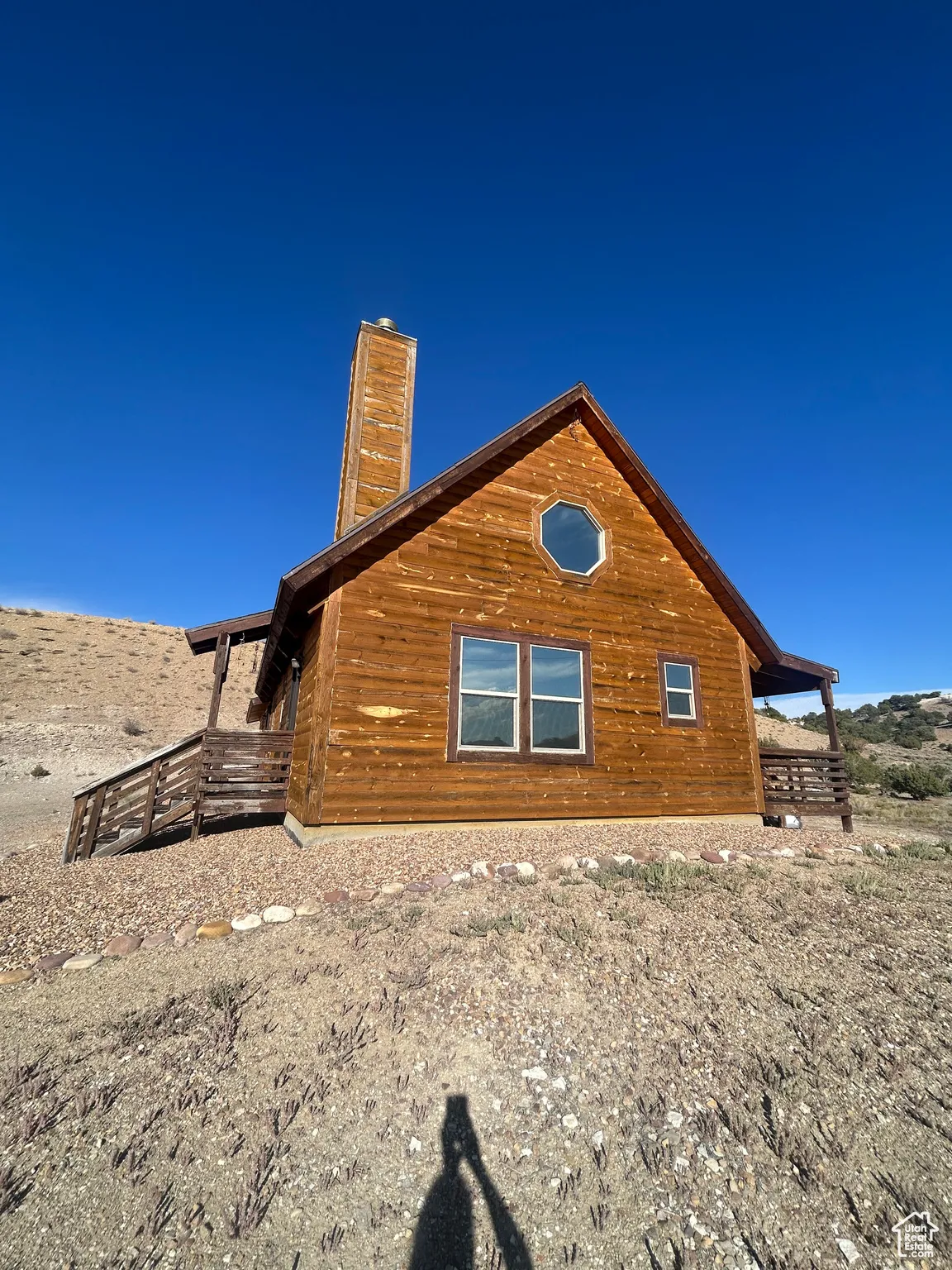View of side of property with a chimney