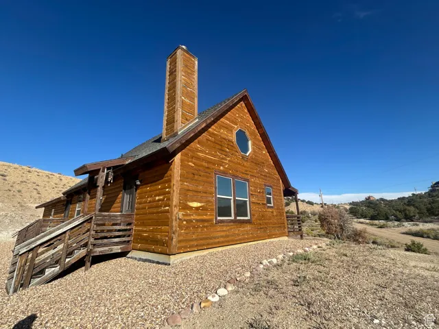 View of home's exterior featuring a chimney