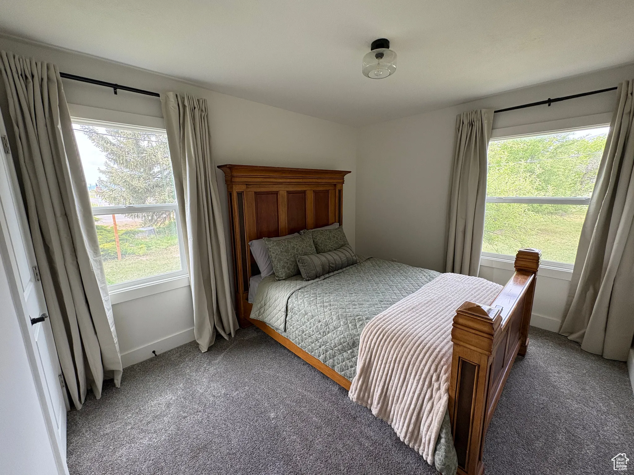 Carpeted bedroom with baseboards