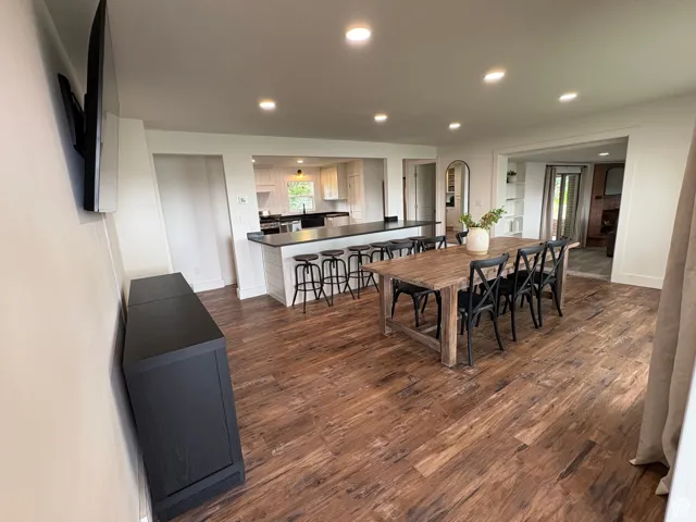Dining space with recessed lighting and dark wood-style floors