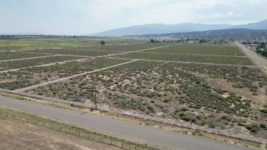 Aerial view of sparsely populated area with a mountain backdrop