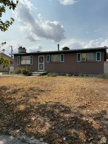 Ranch-style house featuring a chimney