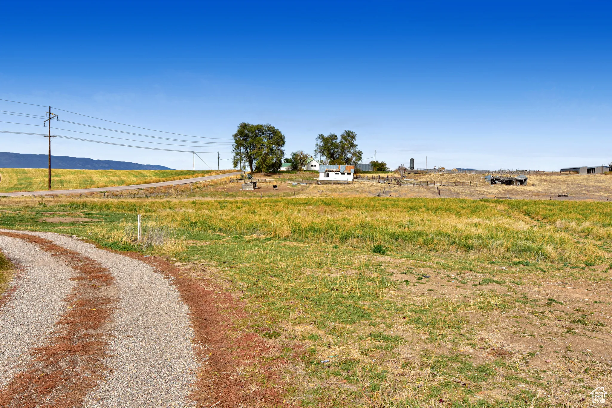 View of road with a view of rural / pastoral area and a mountain view
