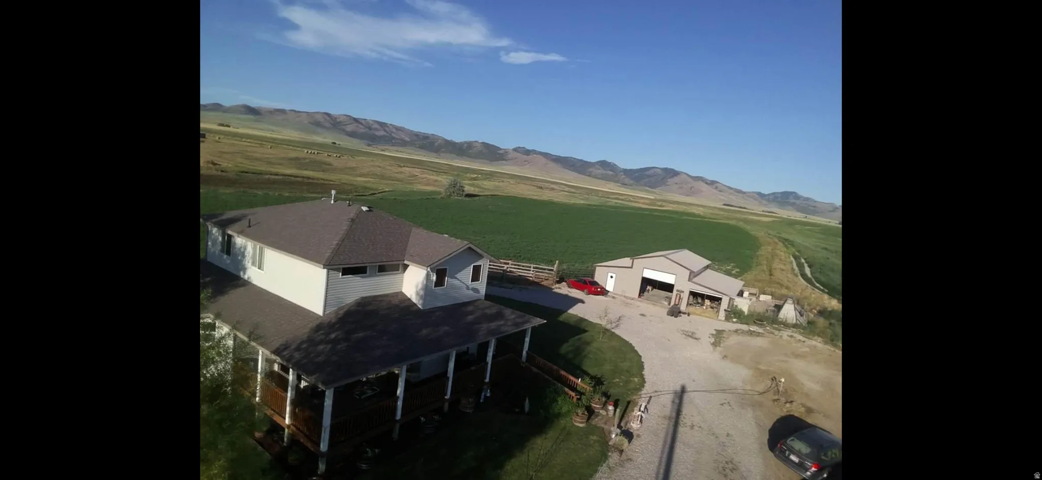 Aerial view of sparsely populated area with a mountainous background