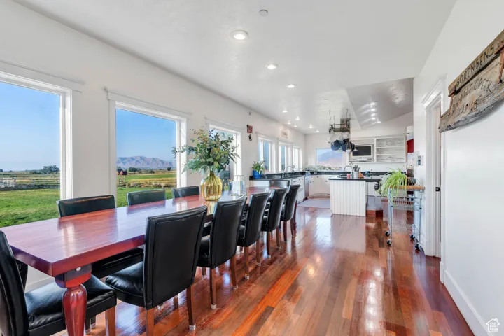 Dining room featuring dark wood finished floors and recessed lighting