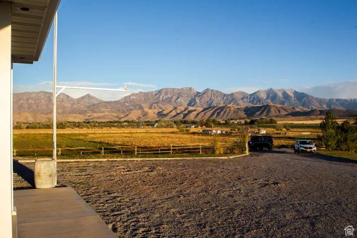 View of mountain backdrop with rural landscape