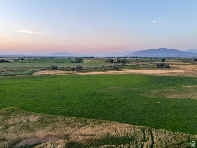 View of mountain background featuring rural landscape
