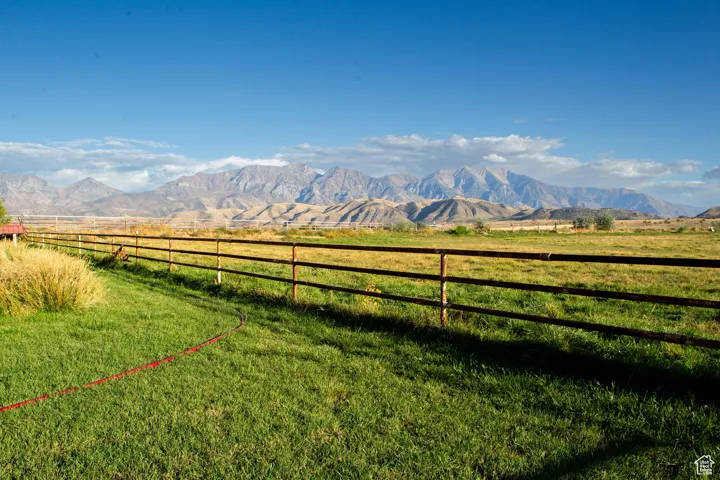 View of mountain background featuring agricultural land