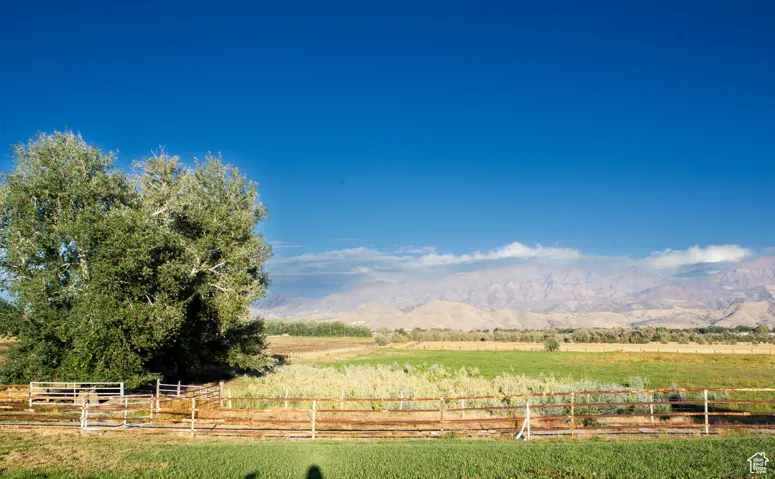 View of yard featuring a mountain view and a view of countryside