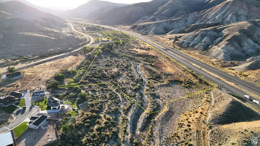 Aerial view of property's location with mountains and property boundaries highlighted