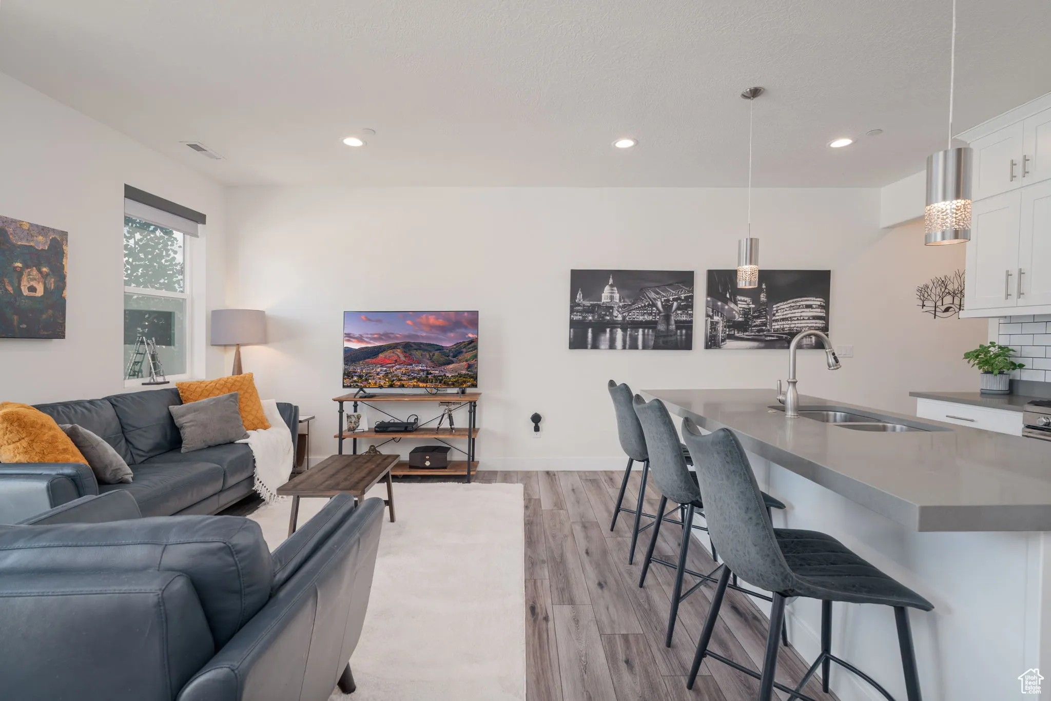 Living room featuring light wood-style floors and recessed lighting