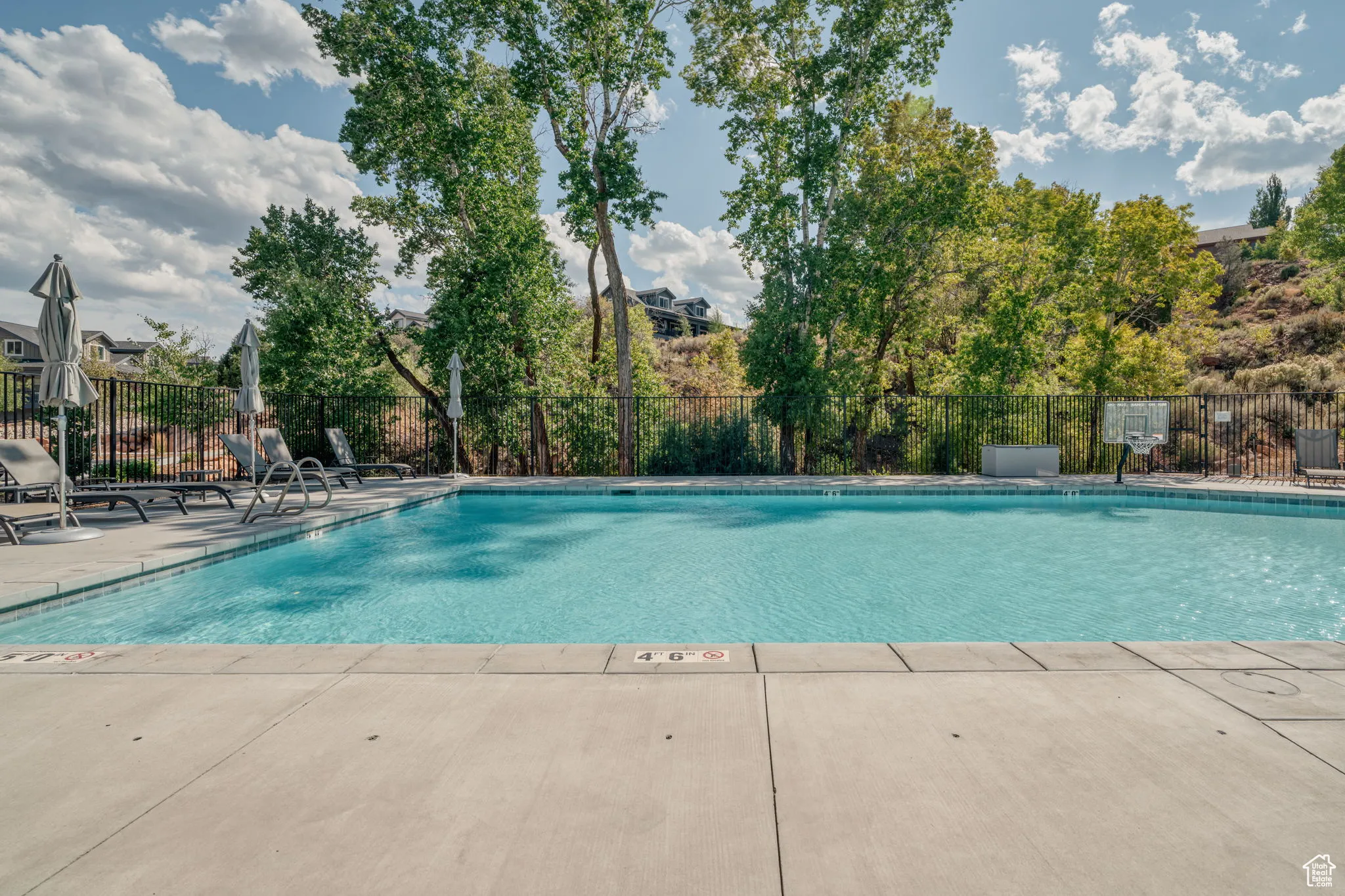 Community pool, hot tub and clubhouse with a nice large outdoor gathering area.