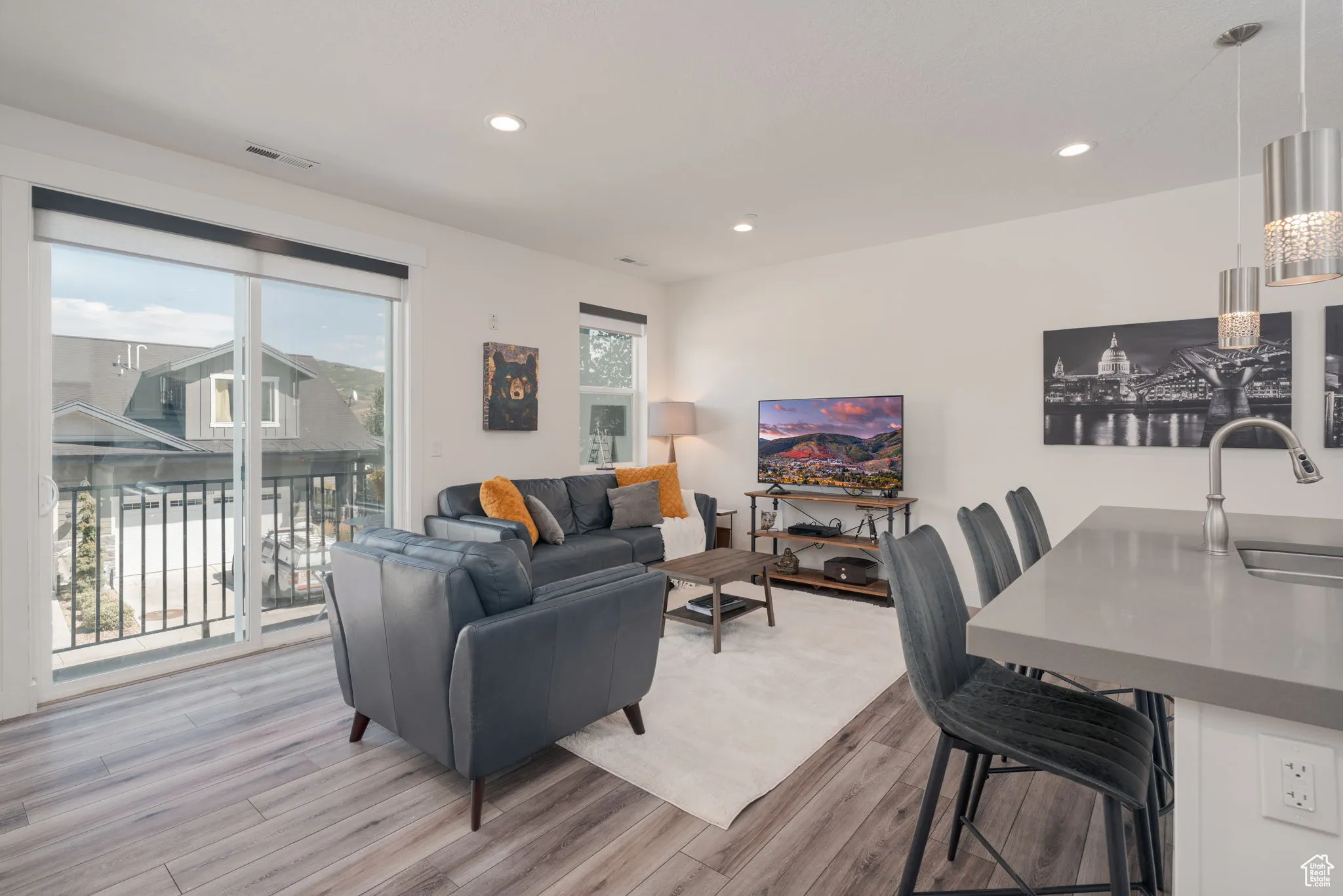 Living area featuring recessed lighting and light wood-style floors