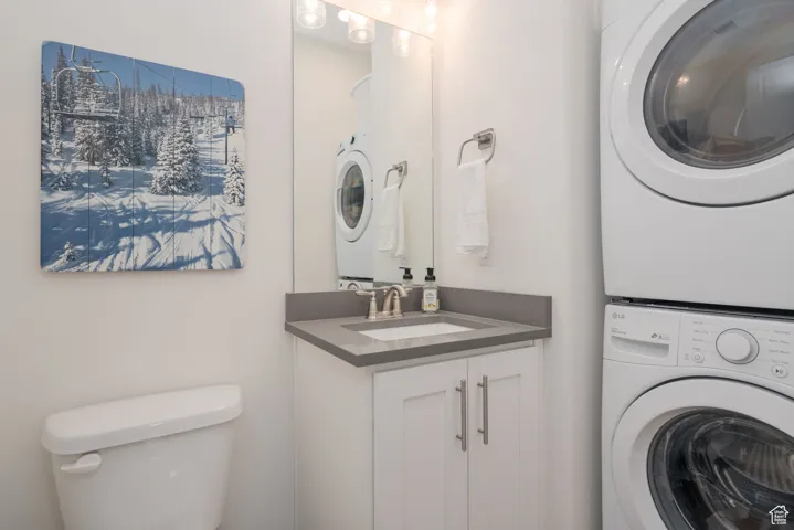 Washroom with stacked washer and dryer on the main floor