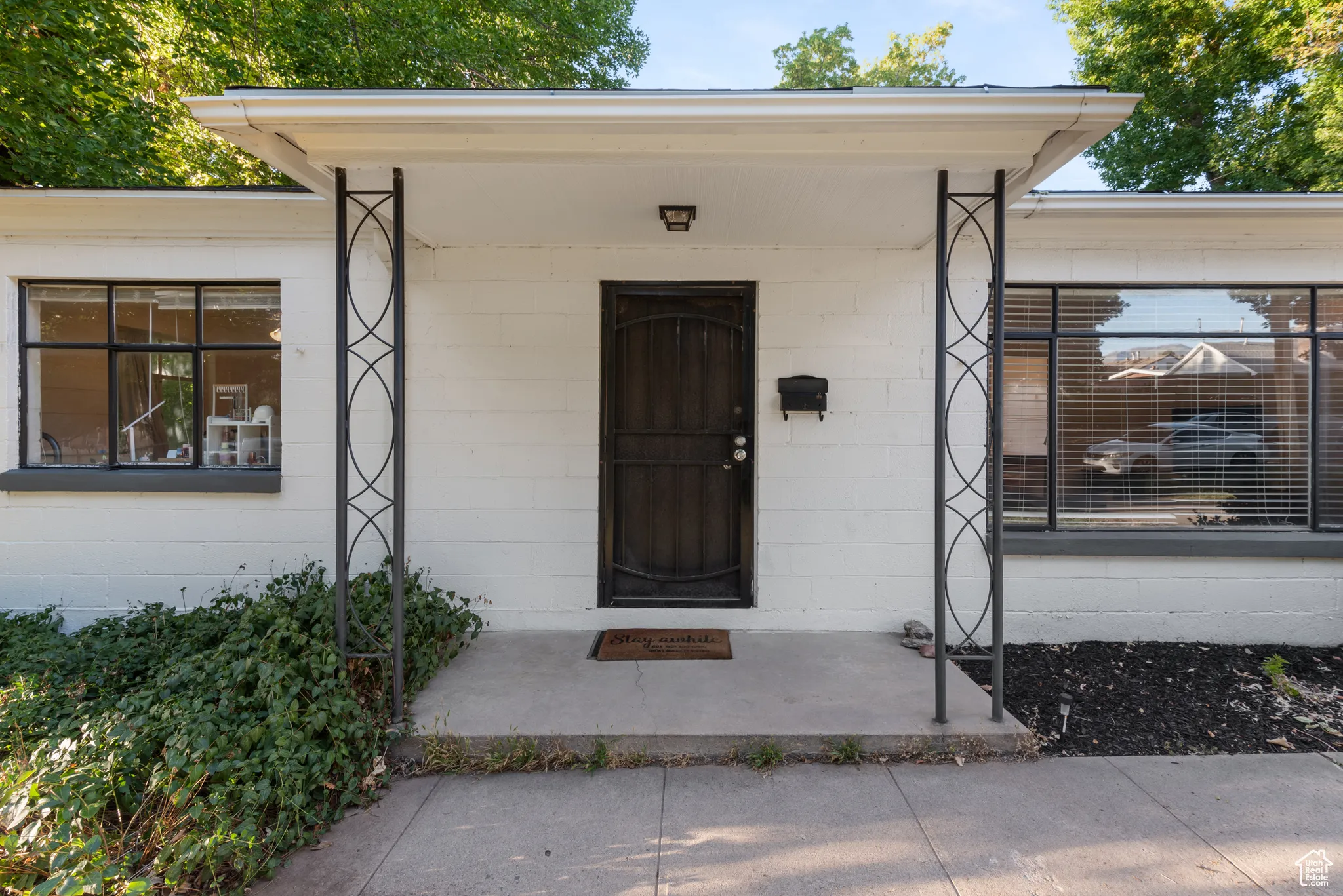 View of exterior entry with concrete block siding