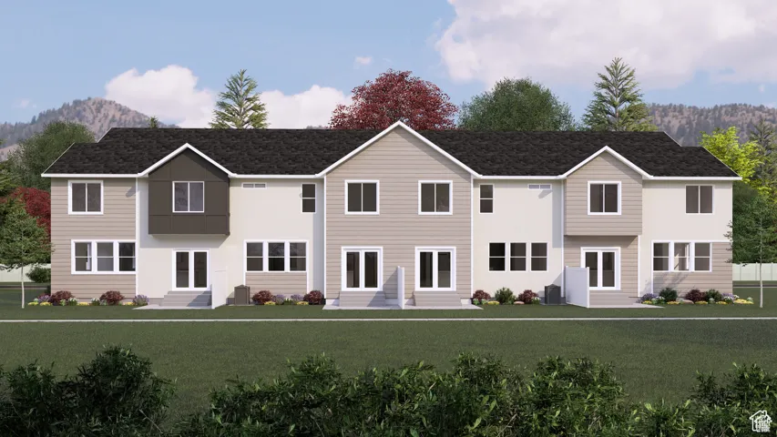 View of front of house featuring a front yard and entry steps