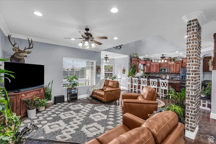 Living room featuring ornamental molding and recessed lighting