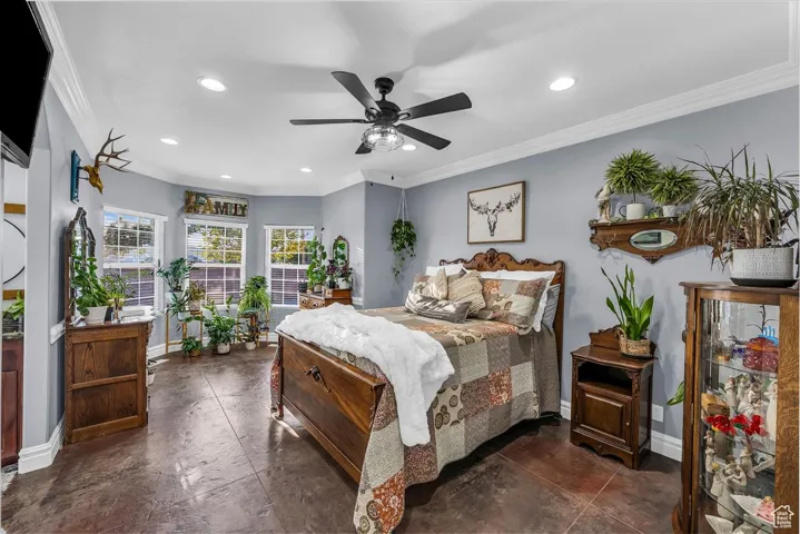 Bedroom with crown molding, a ceiling fan, and recessed lighting