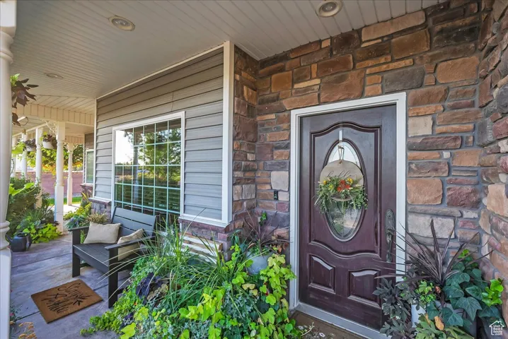 Property entrance featuring stone siding