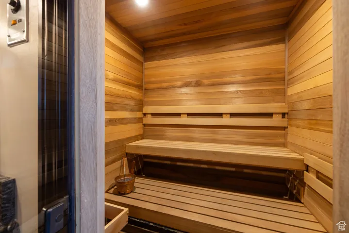 Relaxing sauna featuring wood ceiling
