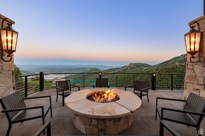 Patio terrace at dusk with a patio and a mountain view