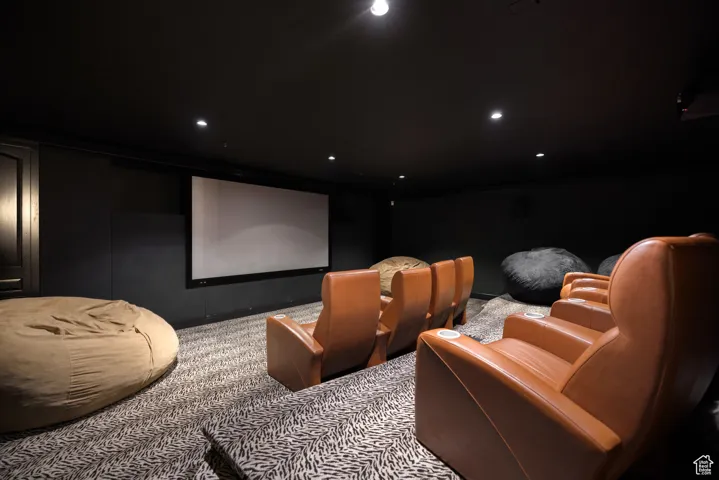 Carpeted home theater room featuring recessed lighting