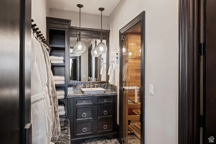 Half bathroom with vanity and a sauna