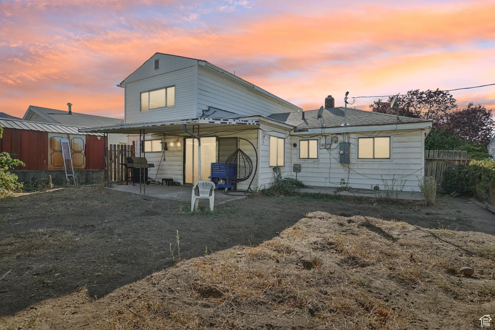 Rear view of property featuring a patio and a chimney