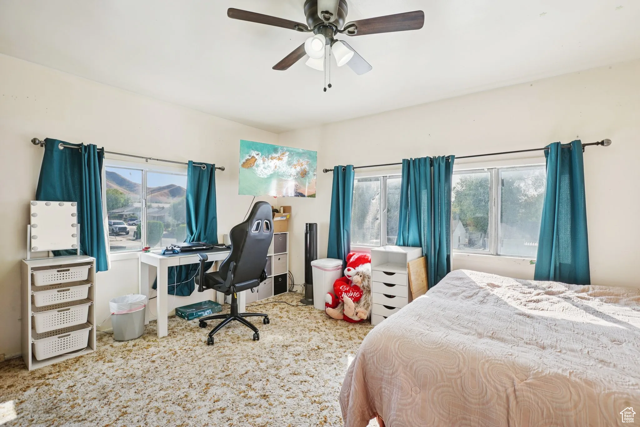 Bedroom featuring a desk, ceiling fan, and carpet floors