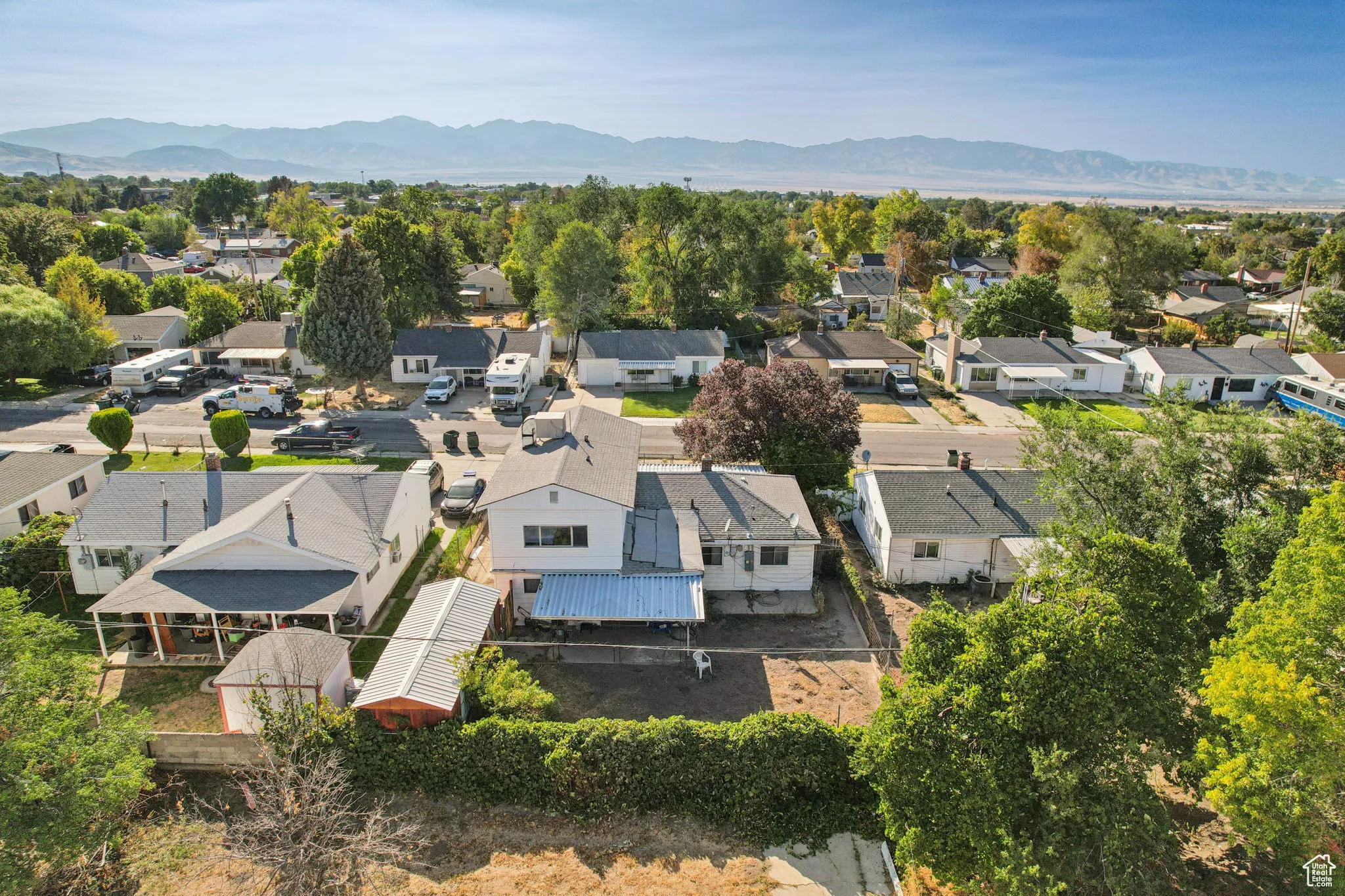 Aerial view of residential area featuring a mountainous background