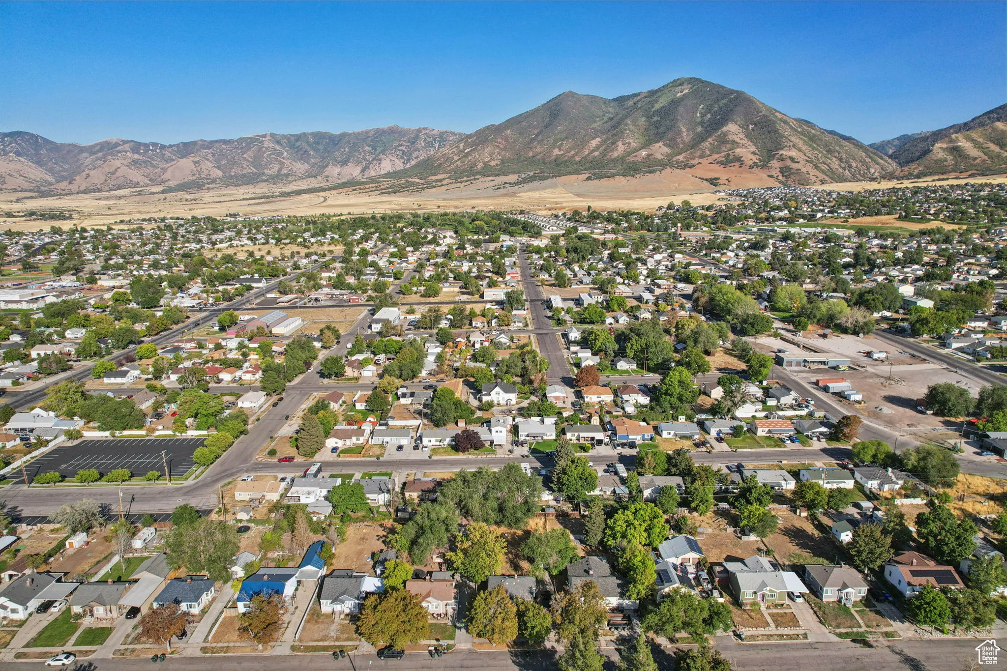 Aerial overview of property's location featuring nearby suburban area