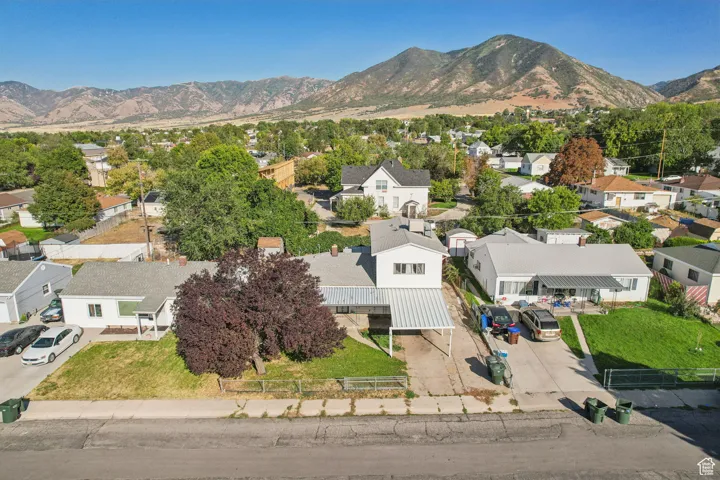 Aerial view of residential area with a mountainous background