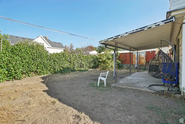 Fenced backyard featuring a patio area
