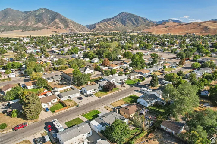 View of property location featuring nearby suburban area and mountains